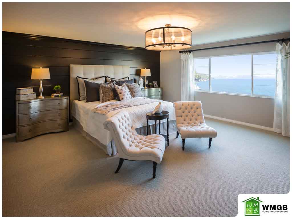 luxury bedroom of house on coast large window looking at ocean