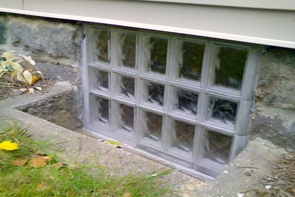 basement window glass block with cement well